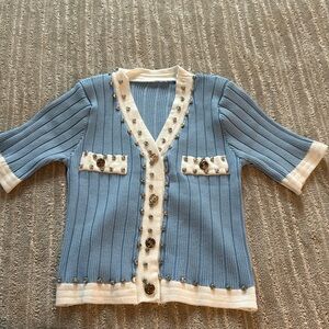 Blue knit embellished top